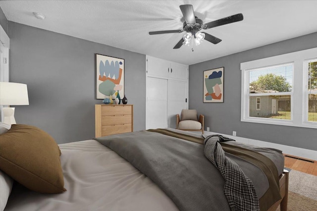 1461 N Harrison Ave, Fresno, CA 93728 - bedroom featuring wood finished floors, a closet, and ceiling fan