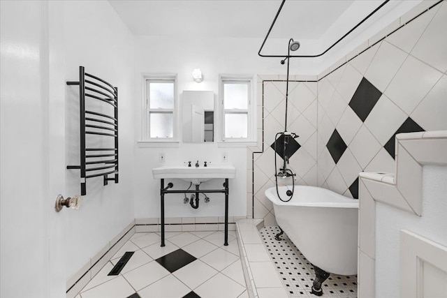1461 N Harrison Ave, Fresno, CA 93728 - bathroom featuring a freestanding bath, a towel warming rack, radiator heating unit, a shower, and tile patterned flooring