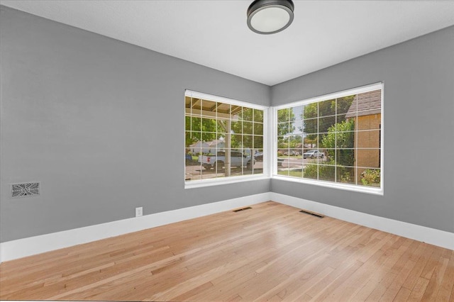 1461 N Harrison Ave, Fresno, CA 93728 - spare room with baseboards and wood finished floors