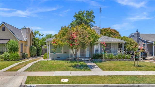 1461 N Harrison Ave, Fresno, CA 93728 - view of front of property featuring a front lawn and a chimney