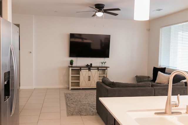4438 N Sandrini Ave, Fresno, CA 93723 - living area featuring ceiling fan and light tile patterned floors