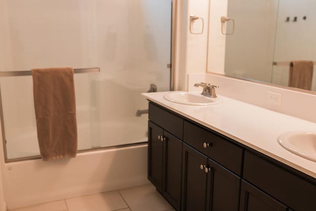 4438 N Sandrini Ave, Fresno, CA 93723 - full bathroom with double vanity, combined bath / shower with glass door, and tile patterned flooring