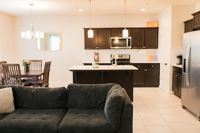4438 N Sandrini Ave, Fresno, CA 93723 - kitchen with open floor plan, appliances with stainless steel finishes, light countertops, dark brown cabinetry, and recessed lighting