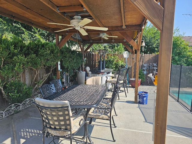 1509 Princeton Ave, Madera, CA 93637 - fenced backyard with outdoor dining space, a ceiling fan, a patio area, and a gazebo