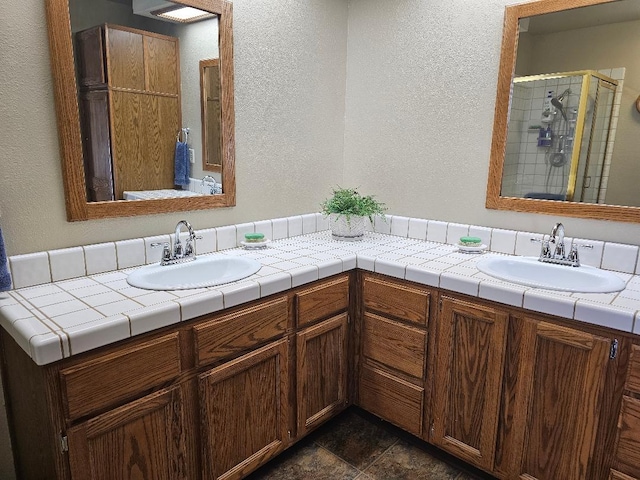 1509 Princeton Ave, Madera, CA 93637 - full bath with double vanity, a textured wall, and a shower stall