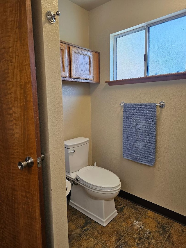 1509 Princeton Ave, Madera, CA 93637 - bathroom featuring toilet and baseboards