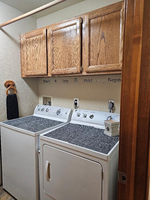 1509 Princeton Ave, Madera, CA 93637 - laundry area featuring washer and dryer, cabinet space, and a textured wall