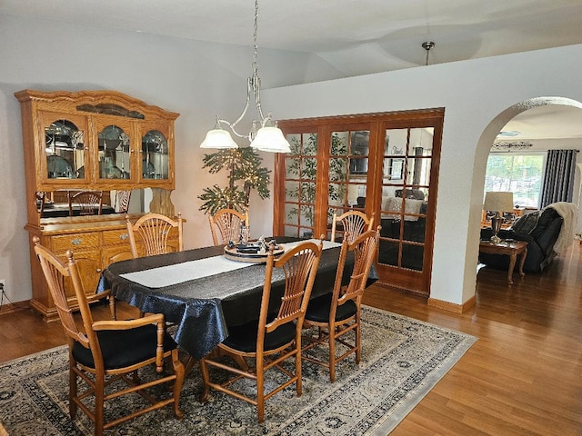 1509 Princeton Ave, Madera, CA 93637 - dining space with arched walkways, wood finished floors, and lofted ceiling