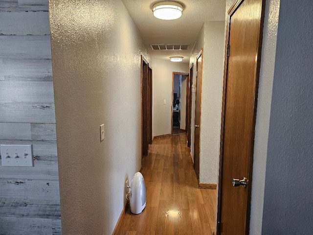 1509 Princeton Ave, Madera, CA 93637 - corridor with a textured wall and wood finished floors
