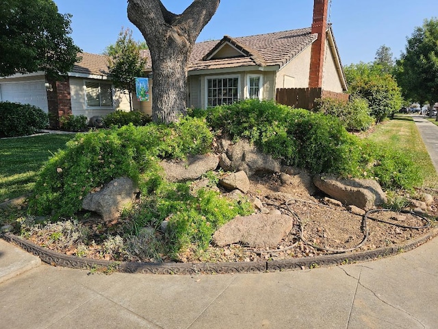 1509 Princeton Ave, Madera, CA 93637 - view of front of home with a tile roof and a garage