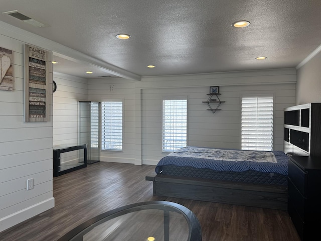 4741 W Mckinley Ave, Fresno, CA 93722 - bedroom featuring a textured ceiling, wood finished floors, and recessed lighting