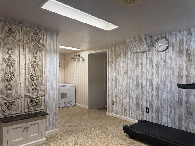 4741 W Mckinley Ave, Fresno, CA 93722 - corridor with a skylight, light colored carpet, and wallpapered walls