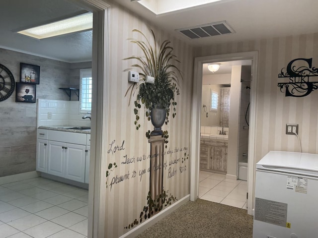 4741 W Mckinley Ave, Fresno, CA 93722 - bathroom featuring wallpapered walls, vanity, and tile patterned flooring