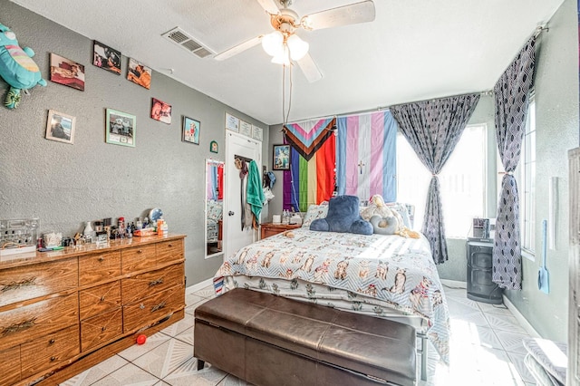 2323 E University, Fresno, CA 93703 - bedroom with a textured wall, tile patterned floors, and ceiling fan