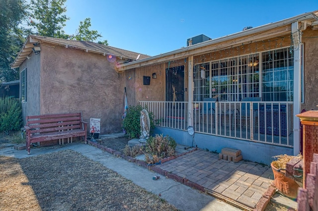 2323 E University, Fresno, CA 93703 - property entrance featuring stucco siding and a patio