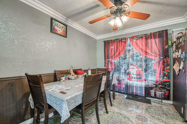2323 E University, Fresno, CA 93703 - dining area featuring a textured wall, a textured ceiling, ornamental molding, ceiling fan, and wooden walls