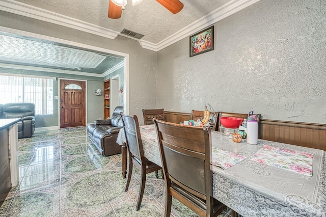 2323 E University, Fresno, CA 93703 - dining room with a textured wall, crown molding, a textured ceiling, a ceiling fan, and wood walls