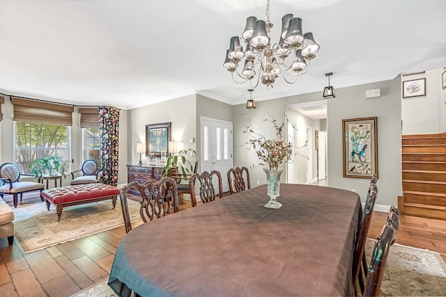 6609 N Dover Ct, Fresno, CA 93711 - dining space with wood-type flooring, stairs, a chandelier, and ornamental molding