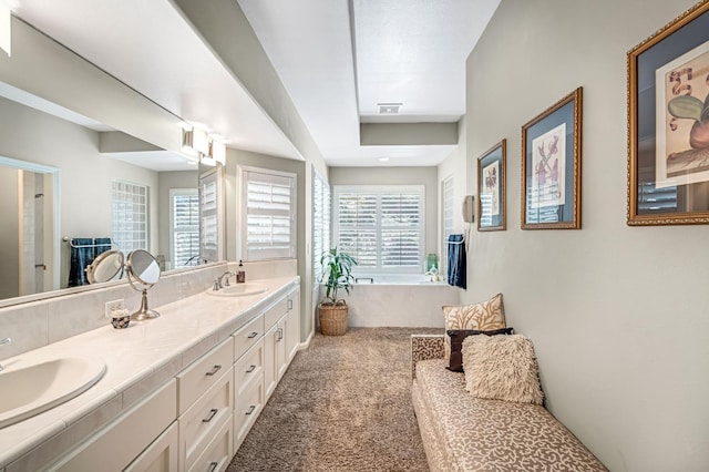 6609 N Dover Ct, Fresno, CA 93711 - bathroom with double vanity and a tub to relax in