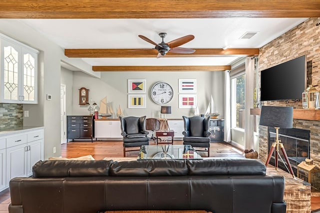 6609 N Dover Ct, Fresno, CA 93711 - living room featuring hardwood / wood-style flooring, beamed ceiling, a ceiling fan, and a fireplace