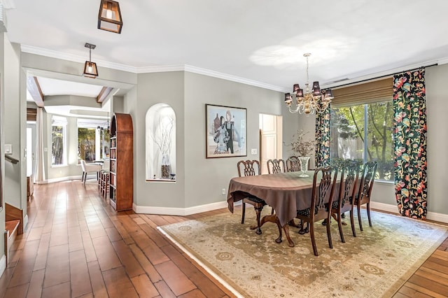 6609 N Dover Ct, Fresno, CA 93711 - dining room featuring a chandelier, hardwood / wood-style floors, and crown molding