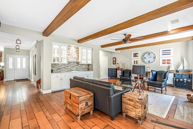 6609 N Dover Ct, Fresno, CA 93711 - living area featuring light wood finished floors, beam ceiling, and a ceiling fan