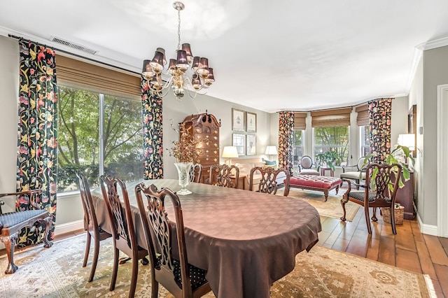 6609 N Dover Ct, Fresno, CA 93711 - dining space with a chandelier, wood-type flooring, crown molding, and healthy amount of natural light