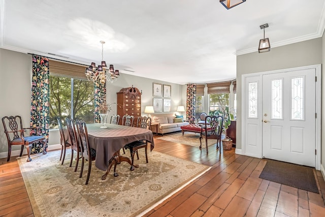 6609 N Dover Ct, Fresno, CA 93711 - dining room with a chandelier, hardwood / wood-style flooring, and crown molding
