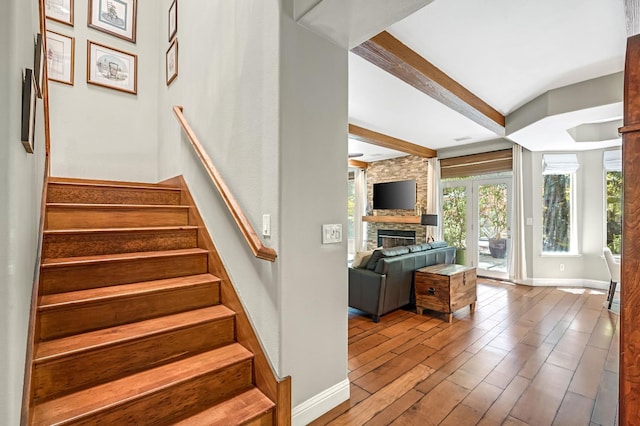 6609 N Dover Ct, Fresno, CA 93711 - stairway with a fireplace, beam ceiling, and wood finished floors