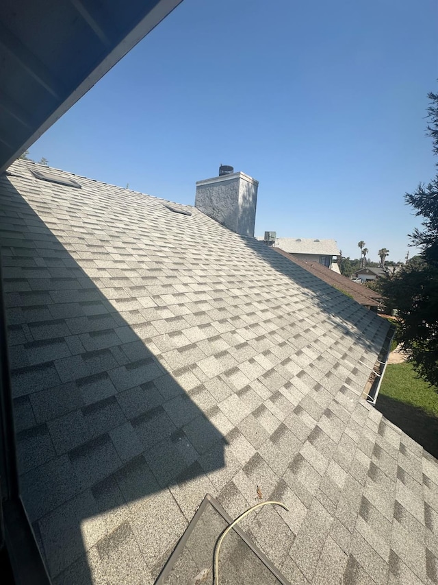 2244 N Prospect, Fresno, CA 93722 - exterior view of a shingled roof and a chimney