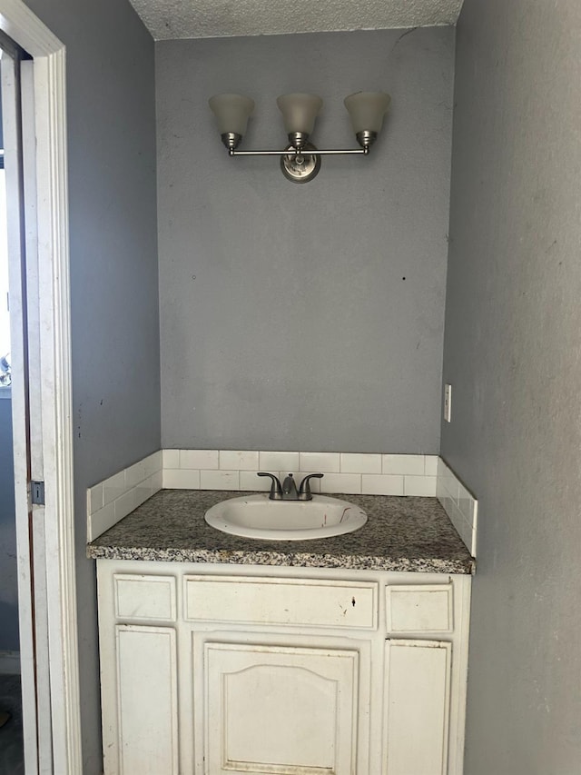 2244 N Prospect, Fresno, CA 93722 - bathroom with vanity and a textured ceiling