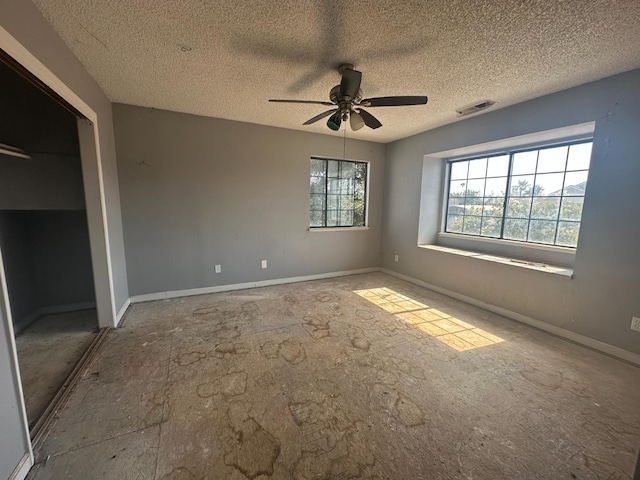 2244 N Prospect, Fresno, CA 93722 - unfurnished bedroom featuring a textured ceiling, ceiling fan, and a closet