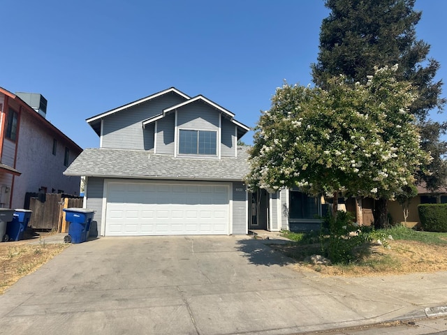 2244 N Prospect, Fresno, CA 93722 - view of front of property featuring driveway, a shingled roof, and a garage