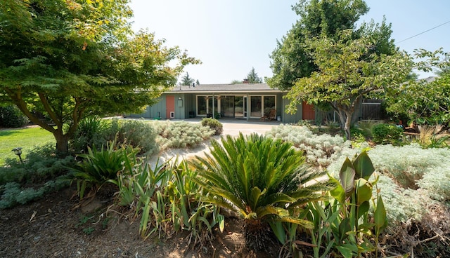 1556 E Loftus Ln, Fresno, CA 93710 - back of property with a patio area and a chimney