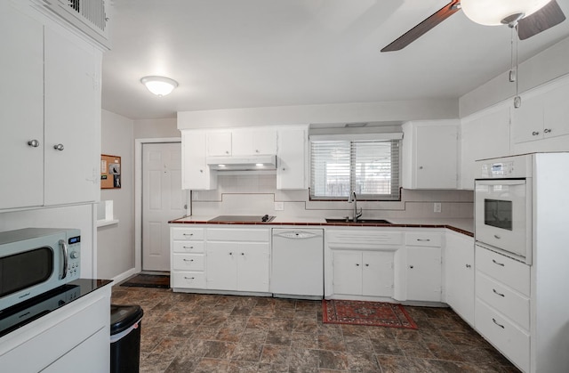 1556 E Loftus Ln, Fresno, CA 93710 - kitchen featuring white appliances, tasteful backsplash, stone finish flooring, ceiling fan, and white cabinets