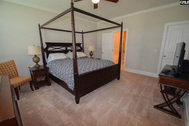 carpeted bedroom with ornamental molding and ceiling fan