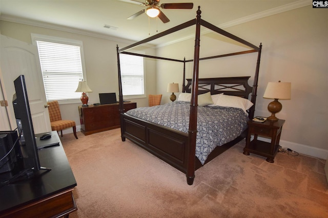 carpeted bedroom featuring multiple windows, crown molding, and ceiling fan