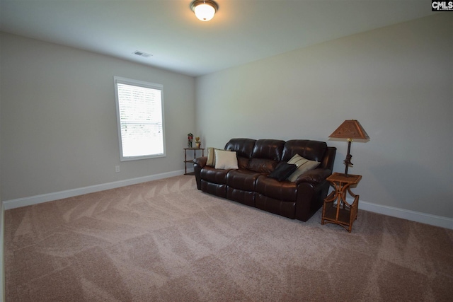 living room featuring light carpet