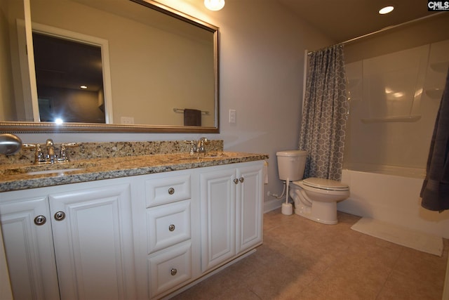 full bathroom featuring shower / tub combo, double sink vanity, tile floors, and toilet