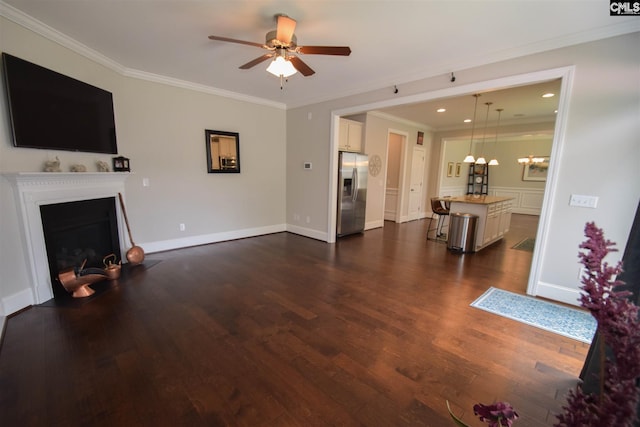 living room with ceiling fan, crown molding, and dark wood-type flooring