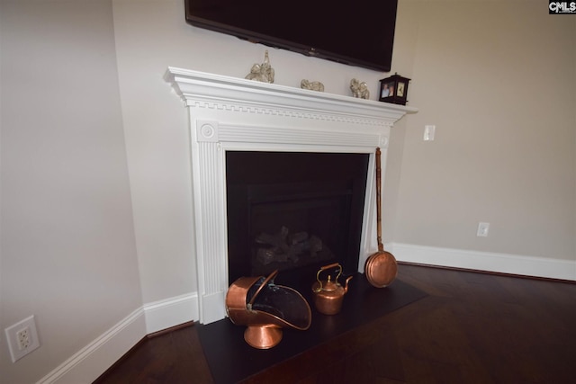 details with dark hardwood / wood-style flooring