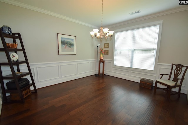 living area with a chandelier, ornamental molding, dark wood-type flooring, and a wealth of natural light