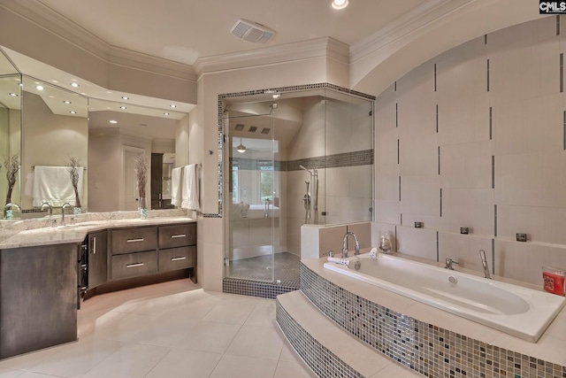 bathroom with tile floors, ornamental molding, separate shower and tub, and vanity