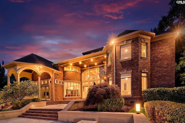 view of front of property with a balcony