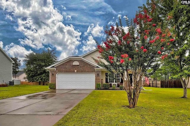 view of front of home with a front lawn and a garage