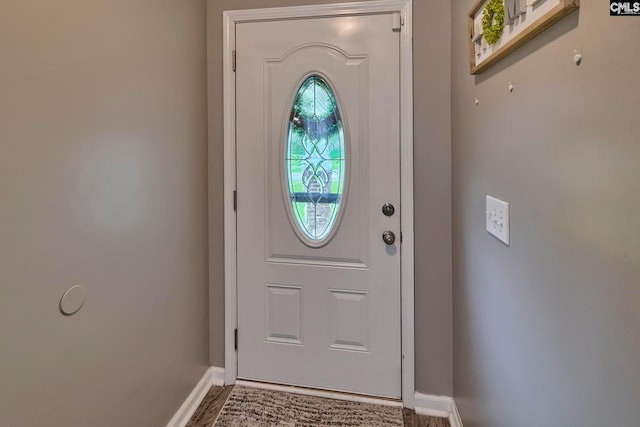 doorway with hardwood / wood-style floors