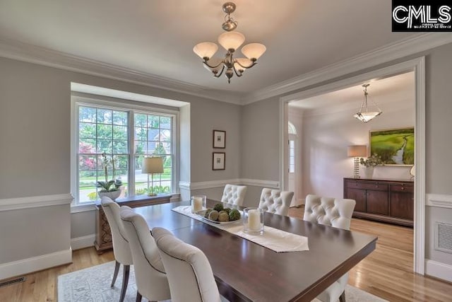 12 Club Ridge Ct, Elgin, SC 29045 - dining room featuring crown molding, a notable chandelier, and light wood-type flooring