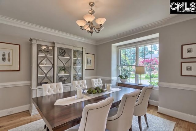 12 Club Ridge Ct, Elgin, SC 29045 - dining room with a notable chandelier, ornamental molding, and light hardwood / wood-style floors
