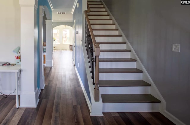 stairway featuring dark hardwood / wood-style floors