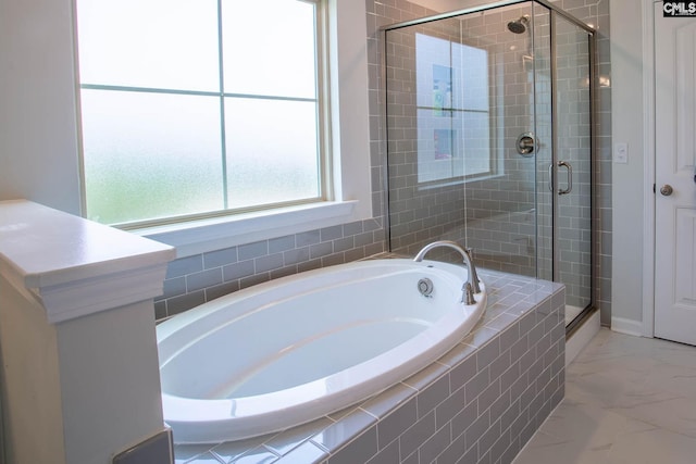 bathroom featuring tile floors and independent shower and bath